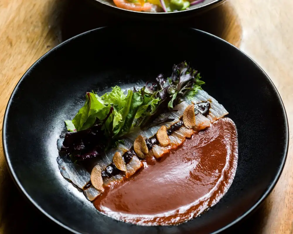 Dishes and drinks served at Outpost Cabo